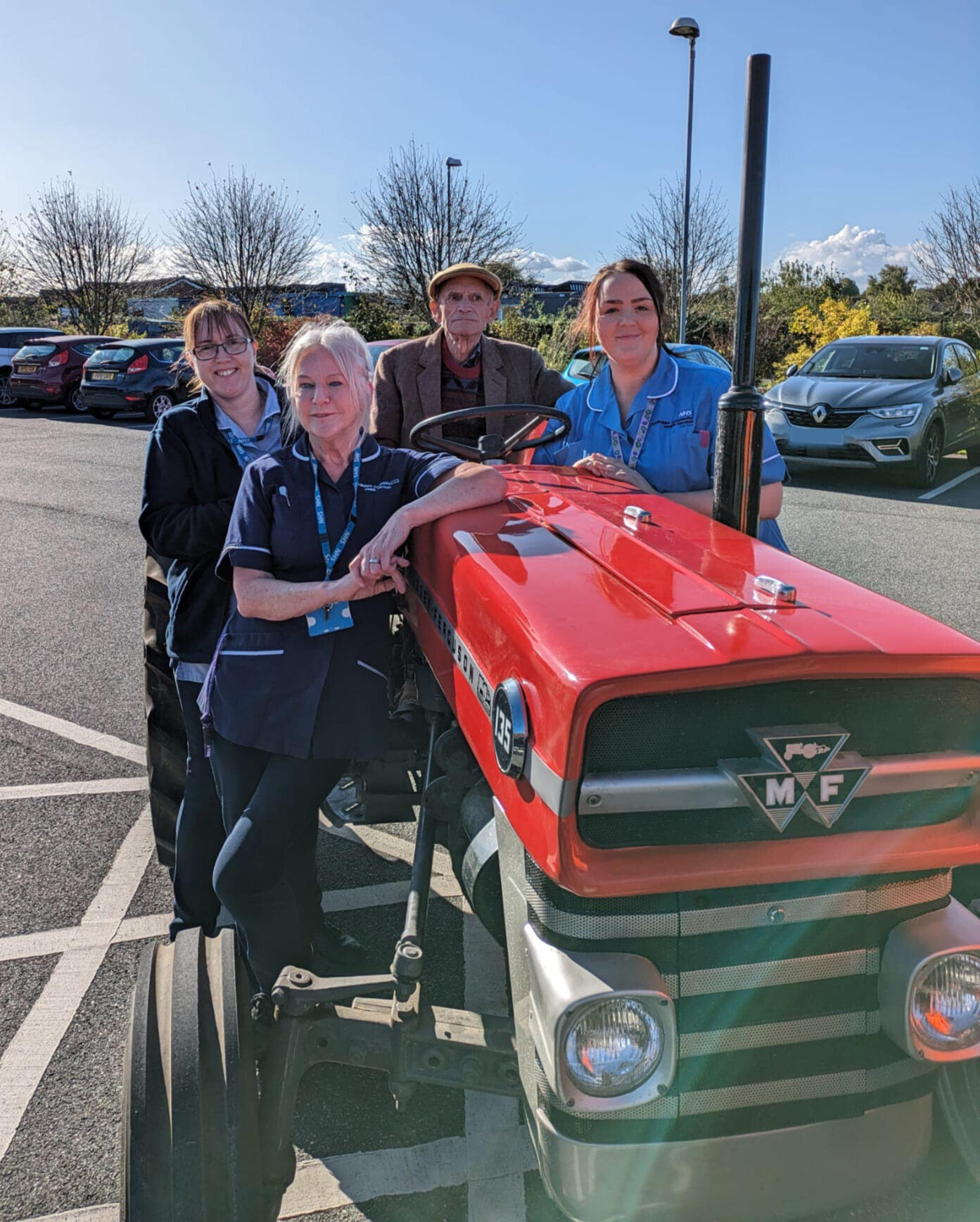 Colin and staff at Butterfly Hospice.png