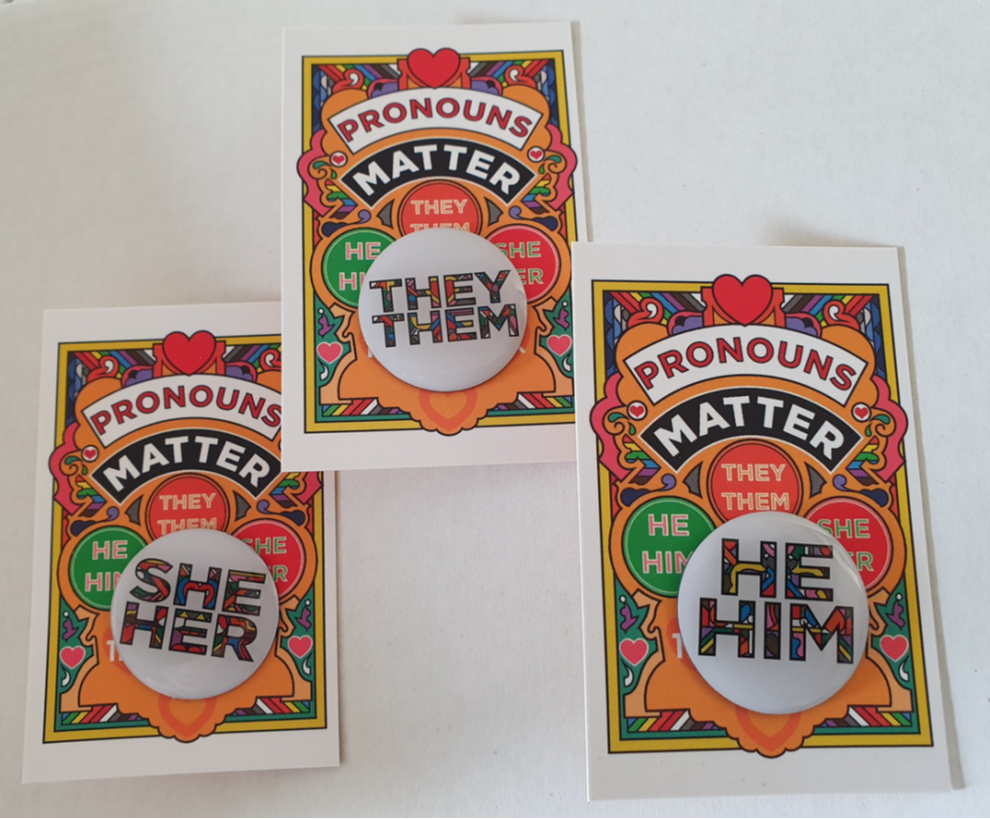 Pronoun badges packaged