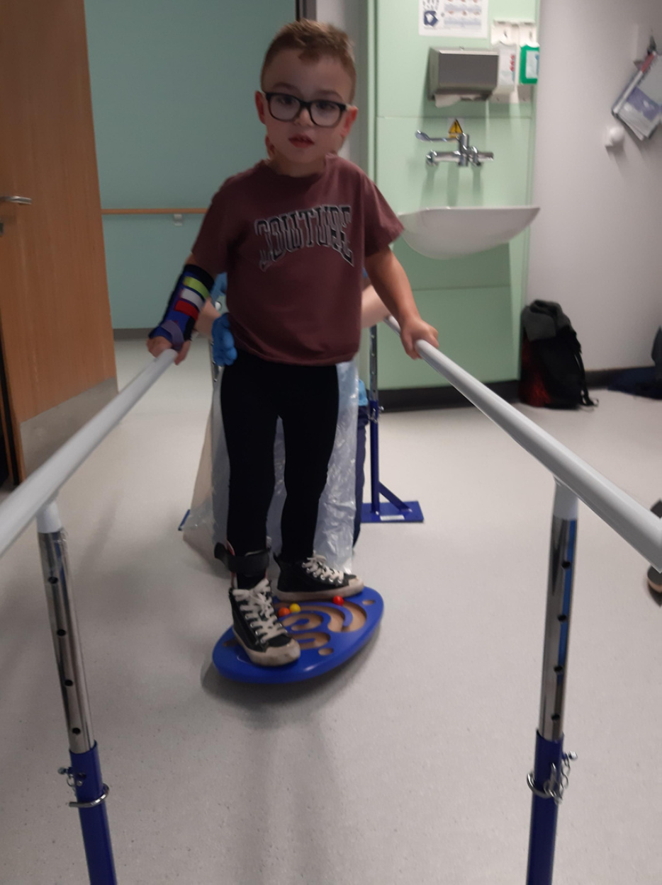 Patient using physiotherapy equipment